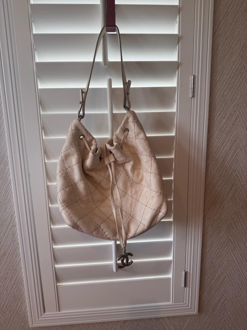 CHANEL Cream Quilted Drawstring Hobo with Charm